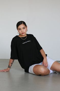 Dropped shoulder oversized t-shirt"escape the ordinary" embroidered stitching80% Polyester, 20% SpandexModel is 5'4" & wears a size mediumSIZE CHART Casual Black Tops With Embroidered Text, Oversized Text Print Top For Athleisure, Trendy Tops With Embroidered Text For Everyday, Casual Tops With Embroidered Text For Everyday, Casual Everyday Tops With Embroidered Text, Relaxed Fit Top With Embroidered Text For Everyday, Oversized Tshirt Poses, Everyday Relaxed Fit Top With Embroidered Text, Oversized Tops With Embroidered Text For Everyday