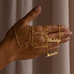 "S I N G A P O R E ∙ C H A I N ∙ N A M E ∙ N E C K L A C E Customize this nameplate necklace to anything your heart desires. Personalized to a name or word of your choosing- this is the perfect gift for a Bridesmaid Proposal, to memorialize an inside joke between friends, or help to keep someone special close. * Material: High Quality Solid 925 Sterling Silver * Finish: Sterling Silver ∙ 18K Gold ∙ Rose Gold * Dimensions: Depending on your font choice, height sizes range from 3mm to 4mm lowercas Jewelry Stack, Necklace Stack, Necklace Chain Types, Top Diy, Gold Water, Gold Name Necklace, Nameplate Necklace, Group Boards, Rose Gold Chain