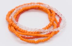 "Stretch Bracelet, Gift For Her, Clear Bracelet, Bracelet Stack, Stackable Bracelet, Bead Bracelet Set, Stretchy Bracelet, Stack Bracelet, Orange Bracelet You will receive 5 bracelets as pictured in orange and clear. .     Stack these together or wear them alone, can be worn in any combination. Beads these are made with * 11/0 seed beads * 6/0 seed beads * 8/0 seed beads * clear beads Bracelets are made standard size which is a size 7\". If you need a bigger size please message me first to check Orange Stackable Bracelets With Round Beads, Stackable Orange Round Beaded Bracelets, Adjustable Orange Stackable Beaded Bracelets, Adjustable Stackable Orange Beaded Bracelets, Orange Stackable Beaded Bracelets For Gifts, Orange Stackable Beaded Bracelets As Gift, Orange Stackable Jewelry With Round Beads, Orange Stackable Round Bead Jewelry, Adjustable Orange Bangle Bracelet