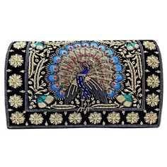 a black and gold purse with a peacock on it's front flap, decorated with flowers