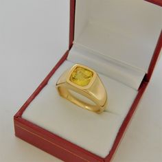 Gemstone: Yellow sapphire A gem certificate of authenticity will be provided at no charge. Treatments: Heated/Lattice Diffusion Specifications: 8.03x8.1mm, approx. 2.89 carats Color: As shown Stunning rare lemon yellow Clarity: Eye clean, almost loupe clean Cut: Cushion cut Weight: 16 grams. Ring size: 10, with all sizes available from 6.5 through 12 This is as fine and elegant a man's ring as you will ever find. The perfect blend of a fine gemstone matched up with a clean classic 14K yellow gol Classic Yellow Gold Ring With Yellow Sapphire, Classic Yellow Gold Yellow Sapphire Ring, Classic Yellow Sapphire Yellow Gold Ring, Yellow Gold Sapphire Signet Ring With Polished Finish, Gia Certified Oval Gold Sapphire Ring, Gold Cushion Cut Topaz Ring For Formal Occasions, Classic Gia Certified Rectangular Sapphire Ring, Formal Gold Cushion Cut Topaz Ring, Classic Yellow Sapphire Ring For Formal Occasions