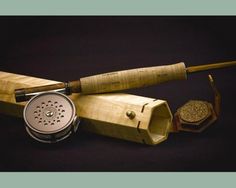 a wooden box with a fishing rod and some other items