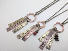 "Please read: Personalized FAMILY NECKLACE- Hand pounded on an old-fashioned anvil one letter at a time. The letters will no doubt be uneven and rustic with a variance in depth and spacing. Tags alternate between antique brass/copper. Family necklaces make a wonderful keepsake. Whether for yourself or as a gift, add your children, Bible verses as you wish. Charms CAN be added as families grow. Mom/dads initials w/heart between or a wedding date also works well on one. - - - - - - - - - - - - - - Personalized Family Jewelry For Mother's Day, Vintage Personalized Jewelry For Mom, Personalized Adjustable Bronze Jewelry, Vintage Personalized Adjustable Charm Necklaces, Bronze Stamped Necklaces For Gifts, Gift Bronze Stamped Jewelry, Vintage Adjustable Necklaces For Personalized Gifts, Bronze Stamped Jewelry For A Gift, Bronze Stamped Jewelry As A Gift