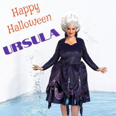 a woman in a purple dress and white hair is standing in water with her arms outstretched