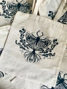 several bags with designs on them sitting next to each other