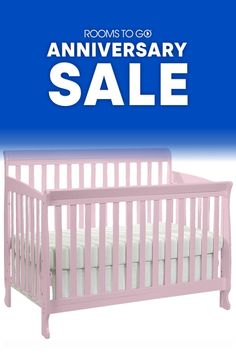 a pink baby crib with the words room to go anniversary sale written on it