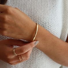 A timeless cuff to go with your every day look. Wear it alone as a statement or stack it with your other favorite bracelets. Our Everyday Cuff is available in a smooth or hammered finish. Arrives in our satin drawstring jewelry bag, perfect for storage or taking your jewelry on the go! DETAILSAvailable in 14k Gold Fill and Sterling SilverHypoallergenic, Nickel Free and Water Safe MEASUREMENTSXS is 5.5" longS is 6" long M is 6.5" longL is 7" long XL is 7.5" long To measure your bracelet size, wra Modern Hammered Bangle For Everyday Wear, Modern Hammered Bangle For Everyday, Everyday Gold Timeless Cuff Bracelet, Timeless Gold Cuff Bracelet For Everyday Wear, Modern Hammered Bracelets For Everyday, Adjustable Everyday Bangle With Bracelet Strap, Adjustable Bangle With Bracelet Strap For Everyday, Classic Adjustable Bracelet For Everyday, Adjustable Everyday Bangle