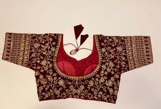 This Maroon Velvet Embroidered Ready Blouse is the perfect addition to your traditional attire collection. Made of velvet fabric, it features intricate embroidery that adds a touch of elegance to any saree or lehanga. Elevate your style and stand out at any event with this must-have blouse. Made to fit size 36" alterable upto 38” Dry clean only Designer Velvet Traditional Wear With Pallu, Velvet Traditional Wear With Pallu For Festivals, Traditional Velvet Saree Blouse Piece, Festive Velvet Blouse Piece With Zari Work, Traditional Velvet Blouse Piece For Festivals, Velvet Saree With Resham Embroidery For Reception, Traditional Velvet Blouse Piece For Festive Occasions, Velvet Traditional Wear With Pallu For Diwali, Diwali Velvet Traditional Wear With Pallu