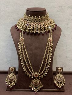 a necklace and earring set on display