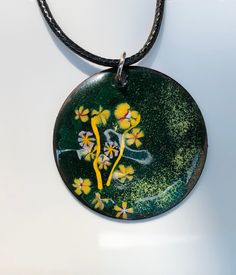 "This is a 1 1/2\" copper enamel pendant that I created adding a base coat of green and adding yellow, lavender and a bit of white. This will arrive with a waxed leather cord of approximately 20-22\", but feel free to add any chain or choker of  your choice. Thanks for looking!" Green Enamel Pendant Necklace, Green Jewelry With Black Enamel For Gift, Green Jewelry With Black Enamel As A Gift, Hand Painted Enamel Round Pendant Necklace, Green Necklace With Large Medallion Pendant, Artistic Green Round Pendant Necklace, Artistic Green Necklace For Gift, Green Enamel Round Pendant Jewelry, Handmade Green Enamel Necklaces