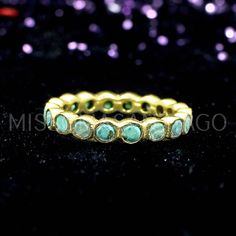 Synthetic Malachite Eternity Ring- Gemstone Ring- Gold Brass Ring- Wedding Ring- Stacking Ring- Malachite Jewelry- Statement Ring- Gift Her Description : Metal : Brass Plating : Gold Plated Gemstone : Malachite Stone Size : 3 MM Approx Weight : 2.66 Gram Approx ❣❣ Handmade Item ❣❣ **Made to Order** » G EM S T O N E D E T A I L « **Gemstone structure may vary from the image as two gemstones do not have the same structure** If you want to see the picture of gemstone, then feel free to contact us. Green Stackable Eternity Band For Promise, Green Emerald Eternity Band Round Shape, Green Emerald Round Eternity Band, Green Stackable Round Eternity Band, Stackable Emerald Rings With Round Shape, Green Stackable Eternity Band, Stackable Emerald Eternity Band Gift, Stackable Emerald Eternity Band As Gift, Round Emerald Eternity Band As Promise Ring