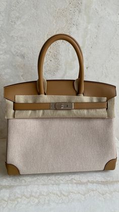 *The bag comes in full set with original store receipt. High-end Beige Travel Bag, Luxury Beige Rectangular Bag, Designer Beige Bags With Gold-tone Hardware, High-end Cream Travel Bag, Luxury Taupe Rectangular Bag, High-end Beige Shoulder Bag With Leather Handles, Luxury Neutral Bags For Formal Occasions, Luxury Neutral Bags, Classic Beige Shopping Bags