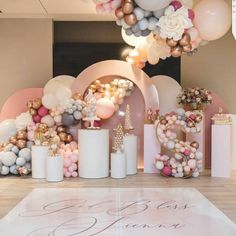 balloons and decorations are on the floor in front of a large sign that says love