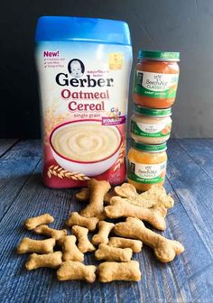 some dog treats are sitting on a table next to a bag of glub oatmeal cereal