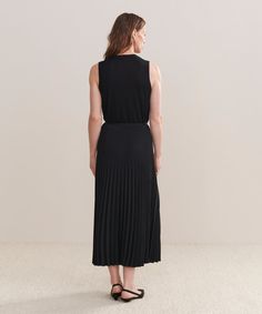 Pleated Skirt Black Dressed up or down with ease, this pleated matte skirt is perfect for any occasion. With an easy, ultra-flattering drape, this piece is meant for styling with varied silhouettes: pair it with a relaxed knit or turtleneck for an elevated look or a slim-fit tee for more casual styling. Spring Midi Dress With Accordion Pleats, Chic Solid Color Pleated Dress, Chic Pleated Dress With Pleated Waist, Chic Pleated Skirt With Folds, Chic Pleated Dress With Solid Color, Solid Chic Pleated Skirt, Flowy Pleated Skirt Dress For Daywear, Daywear Pleated Skirt With Relaxed Fit, Daywear Pleated Waist Relaxed Skirt