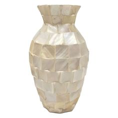 a white vase that has been made out of mother of pearles and is sitting in front of a white background