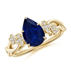 a yellow gold ring with an oval blue sapphire and diamonds