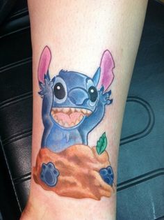 a small tattoo on the leg of a person with an stitched up stitching stitch