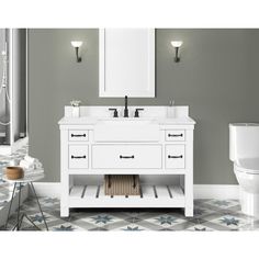 a bathroom with a toilet, sink and mirror on the wall next to a tiled floor