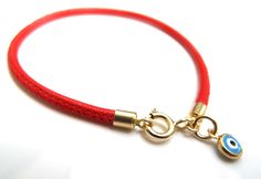 "Kabbalah good luck bracelet 14k gold red string Luxurious bracelet 14k solid Gold beautiful solid yellow 14 k gold and Italian leather bracelet delicate bracelet See description below: * Italian red embroidered leather cord 2.5mm * 14k solid gold and enamel evil eye charm - 6mm - 0.025gr * 14 k solid Gold end caps * 14 solid Gold spring closure *By Symbolina Evil eye: Is a sign of protection that also represents blessings, power, and strength, and is seen as potent in deflecting the evil eye. F Luxury Adjustable Bracelets With Charms, Luxury Adjustable Charms Bracelets, Elegant Adjustable Charms Jewelry, Elegant Red Bracelets For Good Luck, Luxury Adjustable Charms Jewelry, Adjustable Yellow Gold Bracelets With Charms, Minimalist Jewelry With Gold Clasp, Elegant Handmade Jewelry For Good Luck, Elegant Handmade Good Luck Jewelry