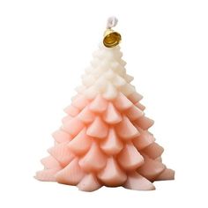 a pink and white christmas tree candle with a gold ornament on the top