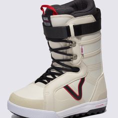 a white snowboard boot with black and red trims on the bottom, in front of a gray background