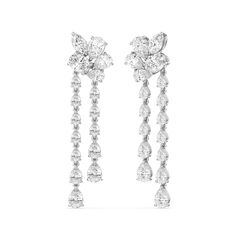 Experience the breathtaking brilliance of the Rain Lily Drop Earrings, a masterpiece made to captivate the senses. This delicate pair of earrings features a blooming post formed by a cluster of diamonds. Twin linear drops detailed with pear-cut diamonds in tapering sizes suspend from the floral post, gently swaying and sparkling as you move. Elegant Cluster Earrings With Sparkling Details, Elegant Cluster Earrings With Sparkling Stones, Royalty Accessories, Blue Wedding Band, Rain Lily, Cluster Chandelier, Something Blue Wedding, Gorgeous Engagement Ring, Pear Cut Diamond