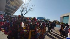 a group of people dressed in colorful costumes