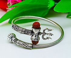 Vintage antique design handmade 925 sterling silver amazing rudraksha beads bahubali shiva trident trishool kada bangle bracelet, excellent gifting jewelry from Rajasthan India. Metal-925 Sterling silver. Item type-Bangle/Bracelet/kada Weight-22.590 grams approx. Width-3.5.mm bangle size Stamped-925. Size-Select your size from option finish-Oxidized. Excellent gifting jewelry Adjustable Silver Jewelry For Puja, Symbolic Bracelet Jewelry For Puja, Silver Bangle For Puja, Symbolic Silver Jewelry For Festivals, Symbolic Oxidized Jewelry For Festivals, Silver Symbolic Jewelry For Diwali, Spiritual Adjustable Jewelry For Navratri, Adjustable Spiritual Jewelry For Navratri, Spiritual Bangle For Puja