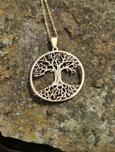 Necklace with tree of life pendant Pendant made of gold-plated metal alloy, on a gold chain with clasp Gold Nature-inspired Metal Necklace, Engraved Gold Nature-inspired Necklace, Nature-inspired Tree Of Life Pendant Necklace, Nature-inspired Engraved Gold Necklace, Nickel-free Yellow Gold Metal Necklace, Yellow Gold Tree Of Life Pendant Jewelry, Elegant Gold Tree Of Life Jewelry, Gold Nature-inspired Pendant Necklace, Nature-inspired Gold Pendant Necklace