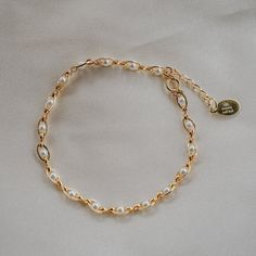 Our Pippa Pearl Bracelet is dainty + modern! What do we love about it? The tiny pearl accents add just a touch of traditional style in a modern way! This bracelet is perfect for any bridal event but can also be worn any time of the year or for any occasion which makes this the perfect gift! BRACELET FEATURES Materials: Brass, 14K Gold, Rhodium, Faux Pearl Finish: Choice of Yellow Gold or Rhodium Plating Dimensions: 6.5" with a 2" extender (can be worn up to 8.5") 14K gold-filled or sterling silv Pearl Bracelets For Party, Elegant Rose Gold Pearl Bracelet With Jubilee Detail, Elegant Rose Gold Pearl Bracelet With Jubilee Style, Pearl Bracelets With Pearl Charm For Parties, Party Pearl Bracelets With Pearl Chain, Pearl White Bracelets With Pearl Drop For Party, Pearl White Bracelet With Pearl Drop For Party, Delicate Rose Gold Pearl Bracelet, Elegant Adjustable Bracelet With Pearl Drop