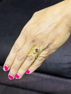 traditional 22 karat gold vanki ring with red stone
  most vanki rings are self adjustable in size.    - 235-GVR315 - in 2.600 Grams for USD $341.53 USD. 
Made in India by Totaram Jewelers Online this product is in Gold - 22 Karat BIS Hallmark 916 Gold  & is an excellent gift for Adult - Women. Ships fully insured with secured guaranteed delivery for free with your order over $250 from New Jersey USA & comes with 30 days exchange policy. 22k Gold Jewelry For Puja, Traditional Ruby Ring In Yellow Gold, 22k Gold Red Jewelry, Traditional Yellow Gold Ruby Ring For Anniversary, 22k Yellow Gold Ruby Ring For Anniversary, Traditional Yellow Gold Ruby Ring With Gemstone, Traditional Yellow Gold Ruby Ring, Gold Ruby Ring Temple Jewelry Style, Gold Ruby Ring Temple Jewelry Gift