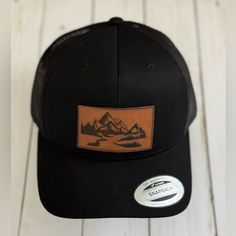 Enjoy This New Trucker Hat, With A Leather Patch Of The Cascade Mountains. Black Baseball Cap For Fall, Black Baseball Cap For Outdoor Fall Activities, Black Baseball Cap Trucker Hat For Camping, Black Snapback Trucker Hat For Camping, Black Trucker Hat For Outdoor, One Size Fits Most, Black Trucker Baseball Cap For Camping, Black One Size Trucker Hat For Outdoor, Black Trucker Cap For Camping, Black Trucker Hat For Camping