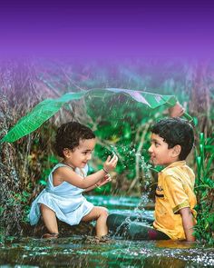 two children are playing in the water under an umbrella and holding hands with each other