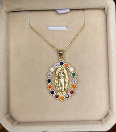 ♡ This stunning piece features a delicately detailed depiction of the Virgin Mary, showcasing her serene presence and gentle expression. Made from a durable and high-quality material that is resistant to tarnishing, this necklace will remain radiant and lustrous, ensuring it stands the test of time! ♡ Pendant size: 2.5cm x 1.8cm ♡ Does not tarnish ♡ Gold Stainless Steel ♡ Chain length: 45 cm/ 17.7 inch We understand the importance of finding meaningful jewelry that reflects one's beliefs, and that's why we've designed this necklace with the utmost care and attention to detail. The durable material ensures that this piece will endure the wear and tear of everyday life, while its tarnish-resistant properties ensure it retains its radiant glow. This Virgin Mary Necklace also makes a thoughtfu Virgin Mary Necklace Gold, Mary Necklace Gold, Mary Necklace, Virgin Mary Necklace, Catholic Jewelry, Meaningful Jewelry, Miraculous Medal, Blue Gift, Religious Jewelry