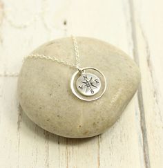 Entirely sterling silver, this necklace features a beautifully detailed compass, inside of a 15mm circle, hanging on sterling cable chain. The compass is 15 x 10 x1mm and is sterling silver (not plated). Please select your length from the drop menu or type your length request in the order comments. About Packaging / Sentiment Card: The standard gift box will include the necklace matted on decorative card stock and placed in a gift box, tied with fabric ribbon. However, this beautiful piece lends Silver Compass Necklace, Compass Necklace Silver, The Compass, Compass Necklace, Fabric Ribbon, Cable Chain, Compass, Pocket Watch, Charm Necklace