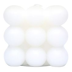 a bunch of white balls sitting on top of each other in front of a white background