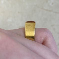 This unique ring features a natural citrine stone in a square cut. This ring is handcrafted in 18k yellow gold and signed by Cartier.
The approximate measurements of the citrine are 8.06mm x 7.92mm x 5.50mm.
This ring is currently sized at 5 and can be resized at no additional cost.
Ready to Make It Yours? Contact us to reserve this ring and to get more info! Modern Gold Princess Cut Ring, Elegant Formal Citrine Signet Ring, Modern Gold Sapphire Ring With Polished Finish, Modern Gold Topaz Ring In Rectangular Shape, Modern Gold Topaz Ring, Hallmarked, Modern Gold Rectangular Topaz Ring, Elegant Citrine Signet Ring For Formal Occasions, Modern Yellow Gold Square Cut Ring, Modern Gold Ruby Ring For Anniversary