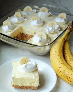 there is a banana cake and two bananas on the table