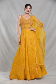 Mango yellow sleeveless full length gown with Mughal bloom embroidery using thread, sequin, beads and cutdana highlights. Paired with a ditsy sequin floret work dupatta. - Aza Fashions Traditional Yellow Maxi Dress For Wedding, Designer Yellow Georgette Gown, Festive Yellow Dress With Intricate Embroidery, Yellow Sleeveless Wedding Gown, Yellow Georgette Dress With Intricate Embroidery, Designer Yellow Dresses With Intricate Embroidery, Designer Yellow Embellished Dress, Yellow Embroidered Dress For Reception, Yellow Embellished Designer Dress