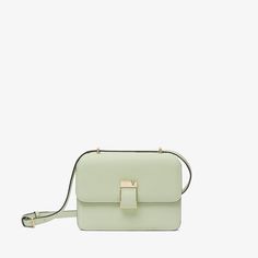 Named after the emerging cultural hotspot in Milan, the NoLo handbag is an ode to the energy of our hometown. This mini version arrives in our signature Millepunte calf skin, its multidimensionality heightened by its striking mint green hue. Inspired by our archive, its lock has a distinctive asymmetrical V-cutout with a magnet concealed behind it. With one central compartment for everyday essentials and an external pocket for easy access to regularly used items. Luxury Green Shoulder Box Bag, Modern Green Flap Bag For Everyday, Luxury Green Rectangular Flap Bag, Luxury Green Top Handle Flap Bag, Luxury Green Box Bag With Detachable Strap, Modern Green Flap Shoulder Bag, Modern Green Shoulder Flap Bag, Modern Green Square Satchel, Versatile Green Formal Shoulder Bag