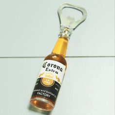 a bottle opener sitting on top of a white tile floor