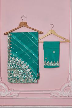 Flaunt your elegant style every day in this beautiful sea green georgette saree with embroidered scalloping border. It comes with a matching blouse piece. Disclaimer: The shown stitched blouse on the model is for display purpose only. The saree comes with a matching blouse piece and finished with fall and piko. Designer Green Pre-draped Saree With Embroidered Border, Fitted Green Chinon Saree, Festive Green Pre-draped Saree With Embroidered Border, Green Resham Embroidered Georgette Saree, Designer Green Sharara With Embroidered Border, Green Georgette Saree With Resham Embroidery, Designer Wear Green Sharara With Embroidered Border, Green Semi-stitched Sharara With Embroidered Border, Semi-stitched Green Sharara With Embroidered Border