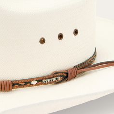 Handmade in the U.S.A. from high-quality shantung, the Ocala 8X Straw Cowboy Hat has a 4” brim and a 4 3/8” cattleman crown with eyelets for increased circulation and breathability. Its rugged Western style is enhanced by a two-tone braided leather hat band with diamond-shaped conchos and an absorbent DRI-LEX® sweatband ensures an all-day, comfortable fit. 4 3/8" Cattleman Crown With Eyelets 4” Brim W Oval Two-Tone Braided Leather Hat Band With Diamond-Shaped Conchos Absorbent DRI-LEX® Sweatband Hat Bands, Straw Cowboy Hat, Leather Hat, Casual Bottoms, Denim Boots, Leather Hats, Diamond Shaped, Hat Band, Cowboy Hat