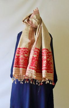 Muga Silk Shawl / Gamucha in traditional motifs from our looms in Assam . It is long enough to be used as a Dupatta with Indian Kurti . The Golden colour is the natural colour of the silk yarns.  The red motifs are in acrylic.  Shawls / Gamuchas  are usually made in cottons and are a must have item in every household of the state . They are used in all kinds of ceremonies and are also used as an welcome gift . Muga Silk  and other pure silk gamuchas  are reserved for individuals who are deemed t Muga Silk, Indian Kurti, Golden Colour, Social Status, Traditional Motifs, Silk Shawl, Silk Yarn, Welcome Gifts, Must Have Items