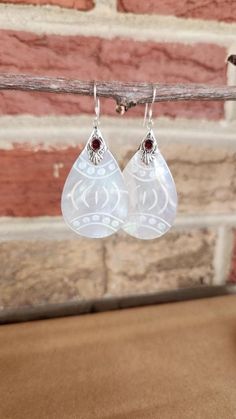 "Genuine Mother Of Pearl Etched Teardrop Earrings with Garnet Accent Set in 925 Sterling Silver * (1 3/4\"H) * Gifts for Her * Trending" White Sterling Silver Teardrop Earrings For Anniversary, Teardrop Mother Of Pearl Jewelry For Anniversary, White Sterling Silver Teardrop Earrings For Gift, White Sterling Silver Teardrop Earrings, Handmade White Sterling Silver Teardrop Earrings, White Sterling Silver Teardrop Pendant Earrings, Teardrop Pearl Drop Mother Of Pearl Jewelry, Elegant Teardrop Mother Of Pearl Earrings, Luxury Teardrop Mother Of Pearl Earrings