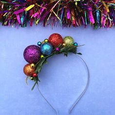 Get noticed with this colourful Christmas headband!  This colourful glitter hair accessory has baubles in colours covering the rainbow spectrum. It also has lots of smaller balls and gold glitter leaves.  The design is secured to a silver metal alice band and can be worn on either side of the head. *Bauble colours may vary but design will be the same* The height is: 3cm /1.2in. This item was lovingly handmade by myself in a smoke free home which does contain one small dog although Ziggy has no c Christmas Hair Band, Christmas Headbands, Rainbow Spectrum, Colourful Christmas, Holiday Headbands, Christmas Hair Accessories, Glitter Leaves, Soul Design, Colorful Glitter