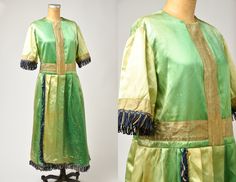 "Edwardian Green Silk Full Figure Satin Dress Gown Faded green silk satin with gold & black rope fringe. Sewn in cotton lining. Metal hook and eye closures in the back. This dress is incredibly strong and very much in wearable condition. Measurements shoulders: 17\" bust: 46\" waist: 42\" sleeve: 12\" length: 49\"" Festive Green Dress With Tassels, Festive Green Tassel Dress, Elegant Green Ceremonial Dress, Elegant Green Dress For Ceremonial Occasions, Black Rope, Yellow Shorts, Dress Gown, Green Silk, Full Figured