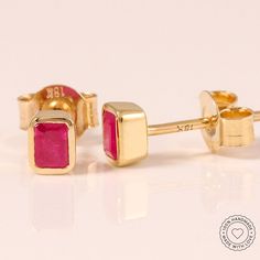 Indulge in a touch of luxury with our Ruby Studs. Crafted with .76 carats of Thai Rubies bezel set in 18K Recycled Yellow Gold, these handmade earrings exude modern royalty. Elevate your style with this exclusive piece from India. Stone curation by Megha Tiwari. Customize with your choice of metal, Yellow Gold, Rose Gold or White Gold. Email info@meghatiwarijewelry.com with your order number and metal preference. 1.4 grams per pair .76 carats of Natural Heated Ruby per pair Made to order, please Luxury Yellow Gold Earrings With Bezel Setting, Luxury Gold Earrings With Bezel Setting, Modern Yellow Gold Bezel Setting Earrings, Luxury Gift Diamond Earrings With Bezel Setting, Luxury Diamond Earrings With Bezel Setting For Gift, Luxury Diamond Earrings With Bezel Setting As A Gift, Luxury Bezel Set Diamond Earrings Gift, Luxury Earrings With Bezel Setting For Gift, Yellow Gold Hand Set Earrings As Gift