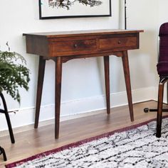 This Writing Desk console with storage makes the perfect station for all of your work and creativity. Also makes a stunning computer desk or craft station.  The table is entirely handmade, and the beautiful wood grains make every piece of furniture unique and slightly different from the last one to the next. This table is supplied assembled, you will only have to attach the legs on to it. Also available in a Natural Stain here: https://lemidcenturyboutique.etsy.com/listing/1714017392 FEATURES Ov Console With Storage, Small Writing Desk, Narrow Desk, Desk Console, Desk Small, Furniture Unique, Craft Station, Desk Writing, Solid Wood Desk